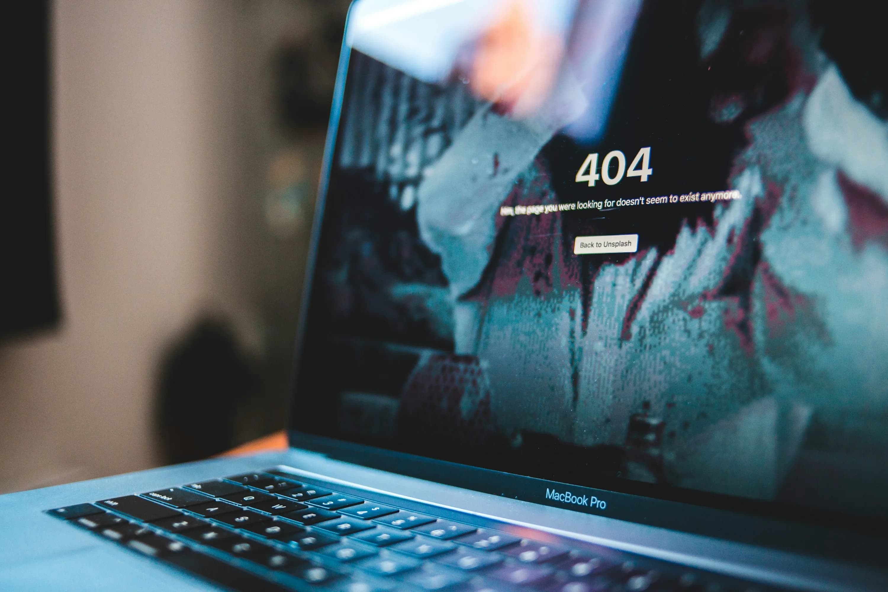 Laptop displaying a system error screen, representing a WooCommerce store crash after a plugin update